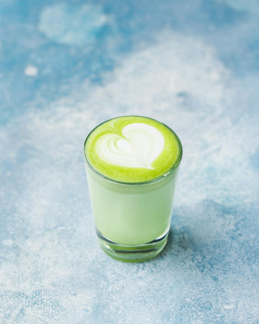 close up photo of glass of matcha drink